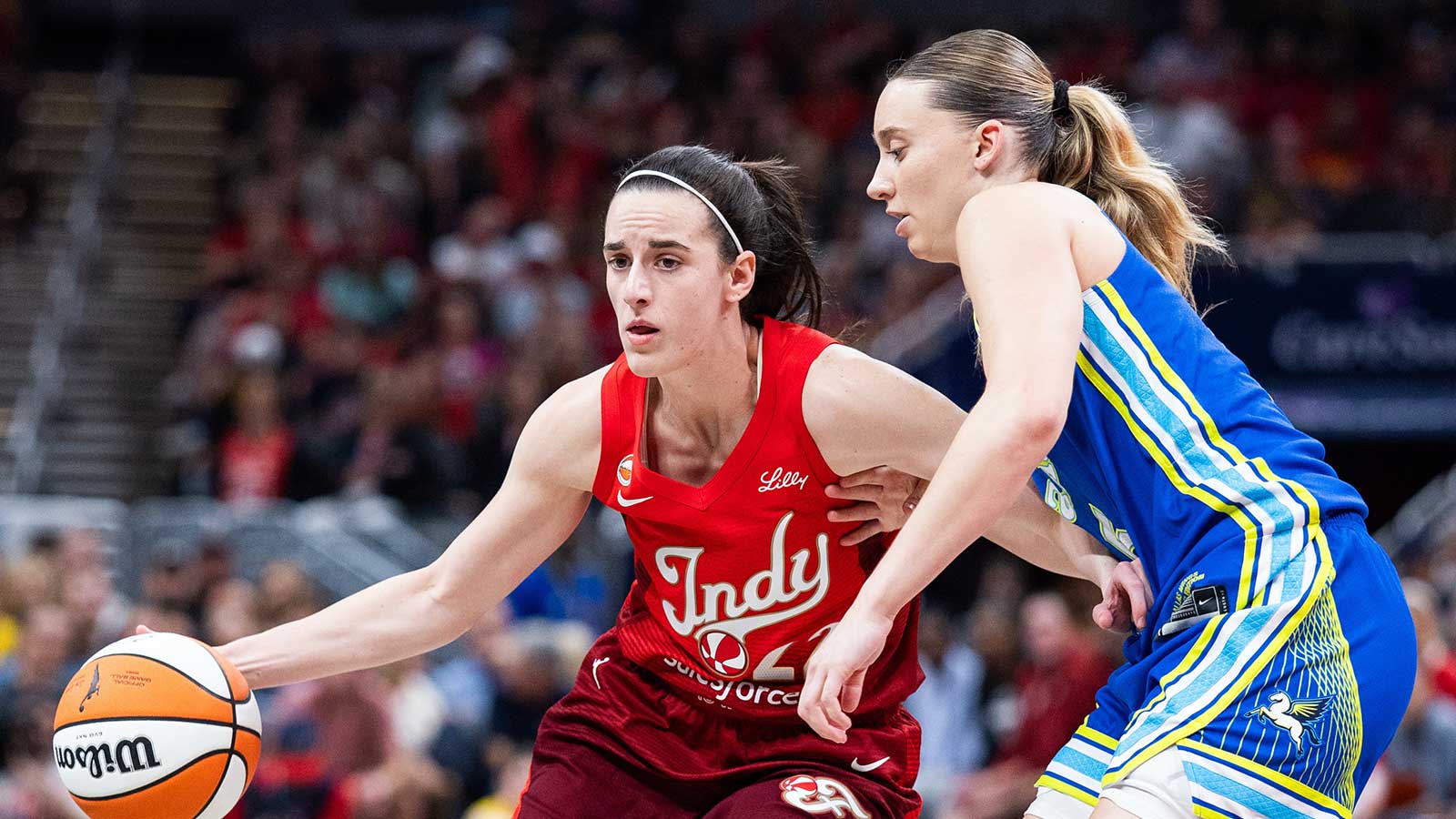 Watch Fever’s Caitlin Clark get absolutely heated at Paige Bueckers after foul