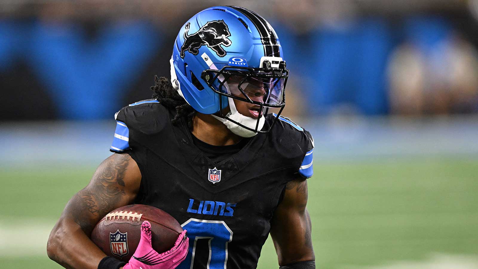 Detroit Lions running back Jahmyr Gibbs (0) rushes the ball against the Tampa Bay Buccaneers during the first half at Ford Field.