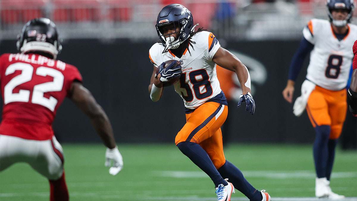Denver Broncos running back Jaleel McLaughlin (38) runs the ball against the Atlanta Falcons in the second quater at Mercedes-Benz Stadium. 