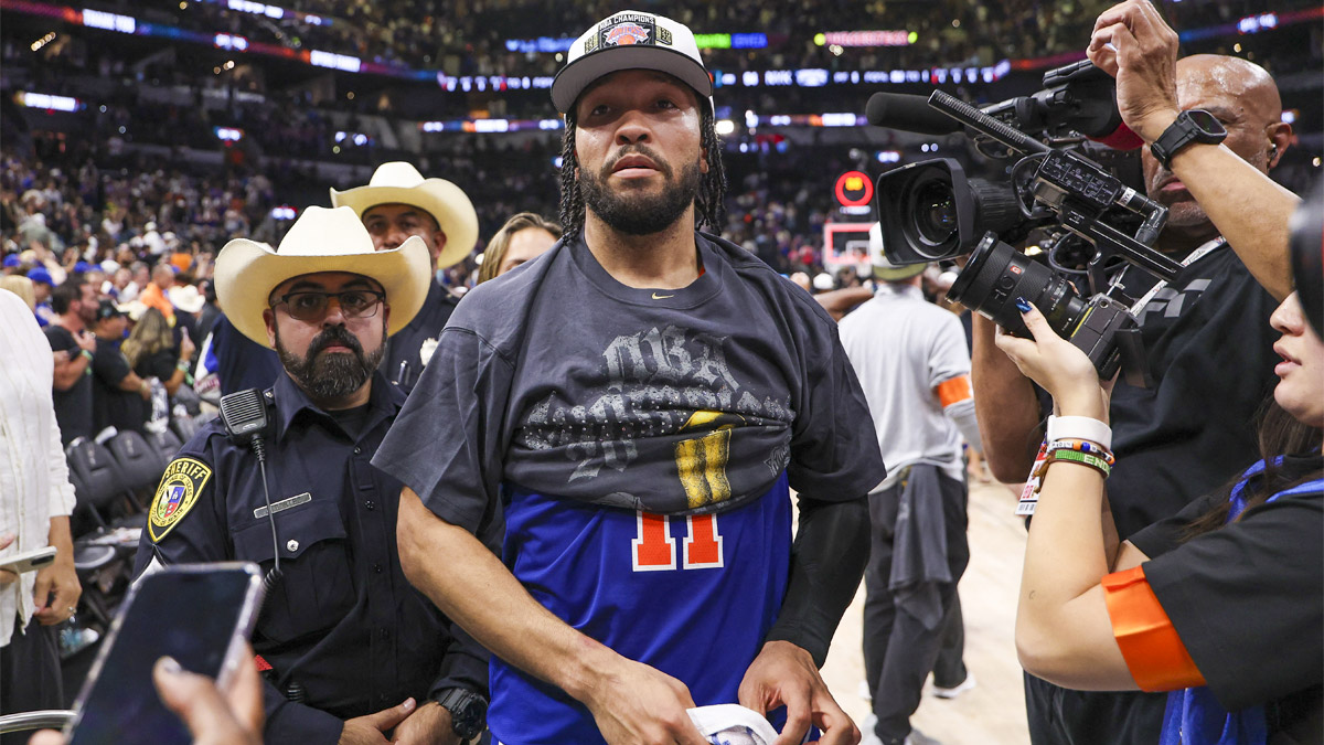 New York Knicks guard Jalen Brunson (11) walks off the court after the Knicks defeat the San Antonio Spurs during game five of the 2026 NBA Finals at Frost Bank Center.