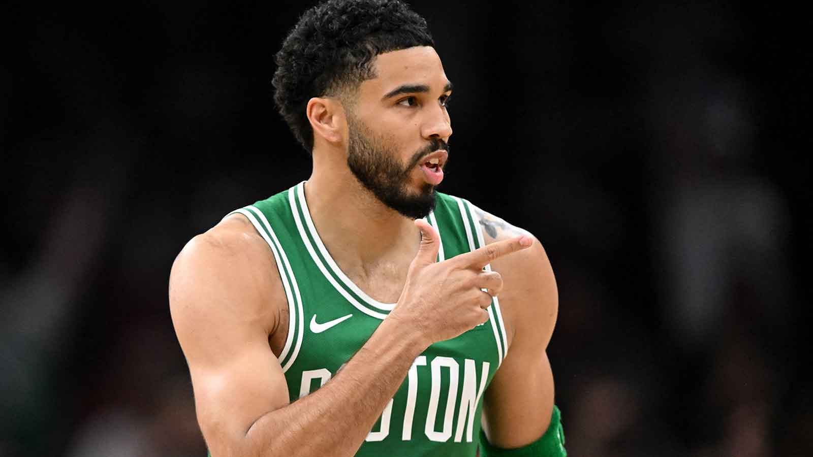 Boston Celtics forward Jayson Tatum (0) reacts after making a three-point basket against the Philadelphia 76ers in the first half of a game two of the first round of the 2026 NBA Playoffs at TD Garden.