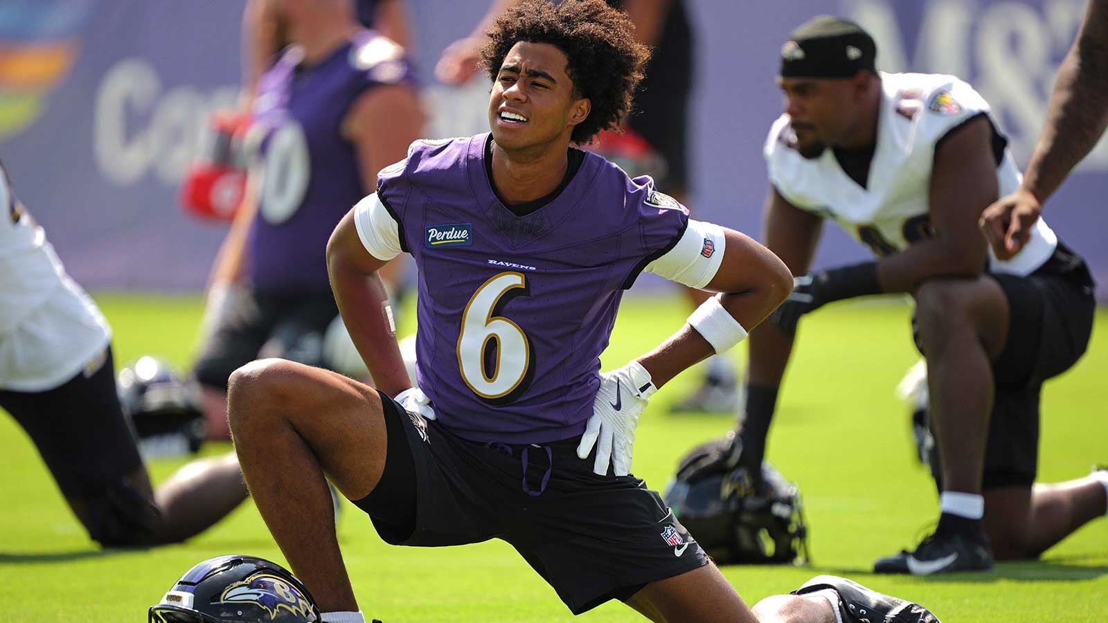 Baltimore Ravens wide receiver Ja’Kobi Lane (6) stretches during practice at the Under Armour Performance Center