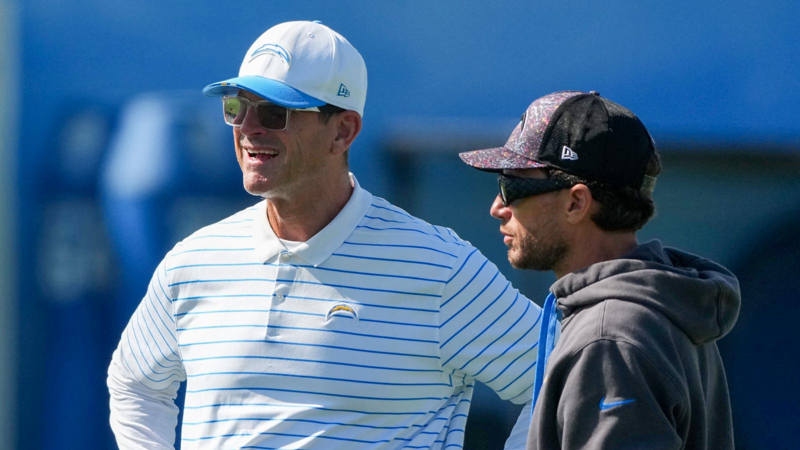 https://wp.clutchpoints.com/wp-content/uploads/2026/08/Jim-Harbaugh-and-Mike-McDaniel.jpg