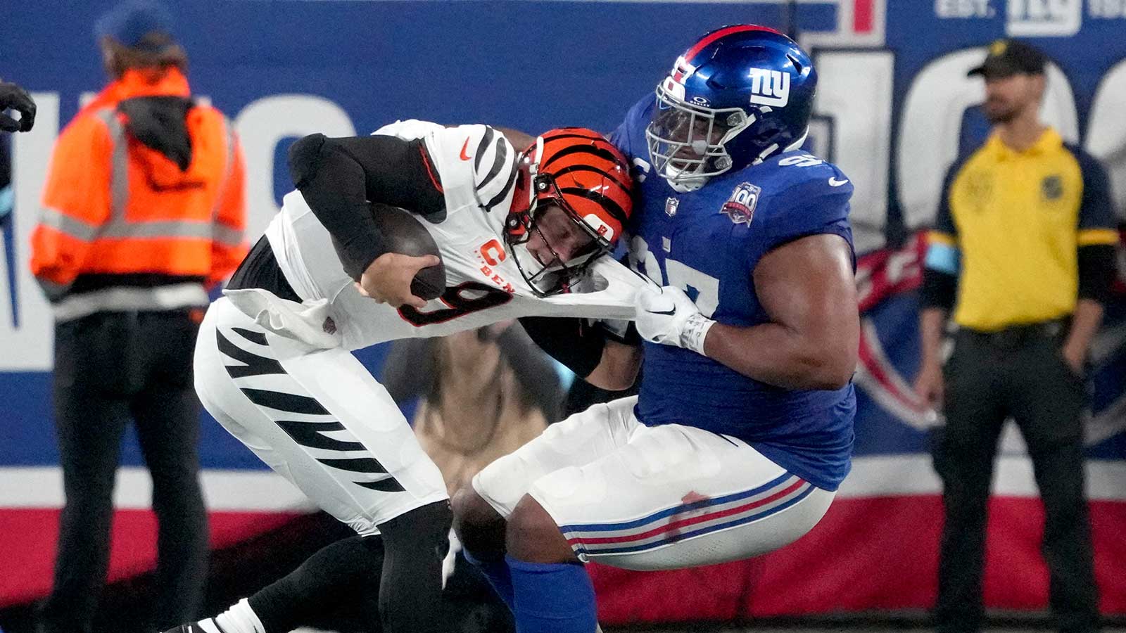 https://wp.clutchpoints.com/wp-content/uploads/2026/08/Joe-Burrow-gets-tackled-by-Dexter-Lawrence.jpg
