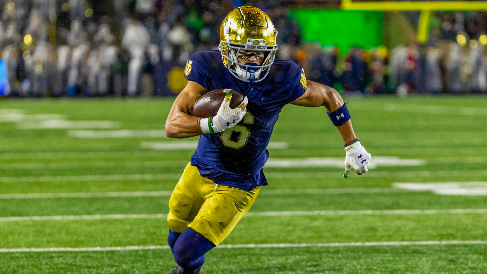 Notre Dame Fighting Irish wide receiver Jordan Faison (6) runs the ball against thel Navy Midshipmen during the first half at Notre Dame Stadium.
