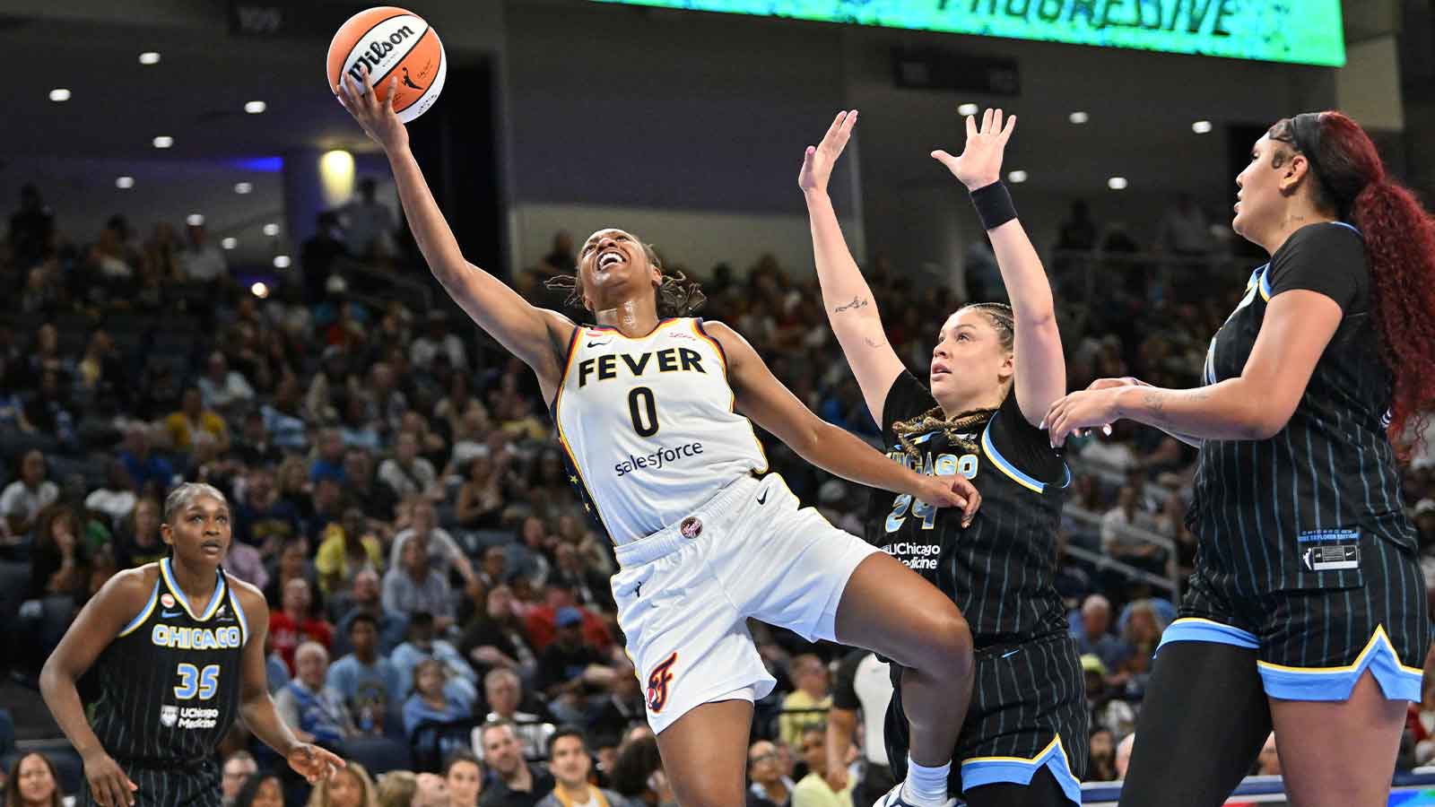 Fever’s Caitlin Clark gives Kelsey Mitchell her flowers after Sky game