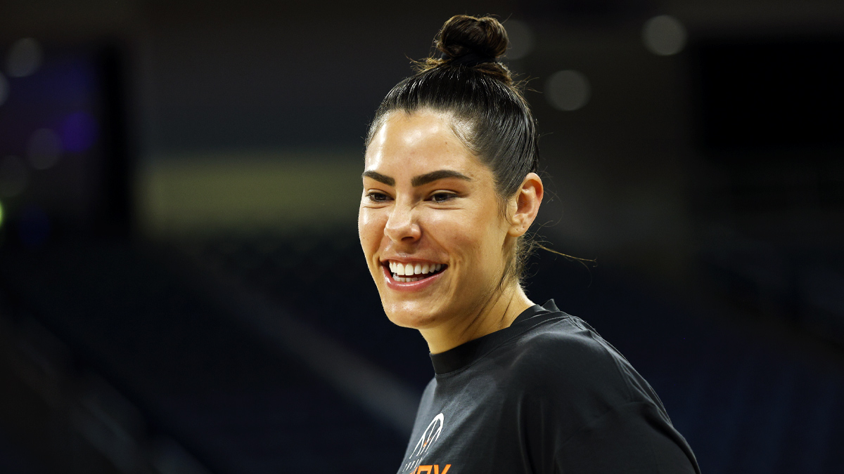 https://wp.clutchpoints.com/wp-content/uploads/2026/08/Kelsey-PLum-smiling-during-warmups-against-the-Sky.jpg