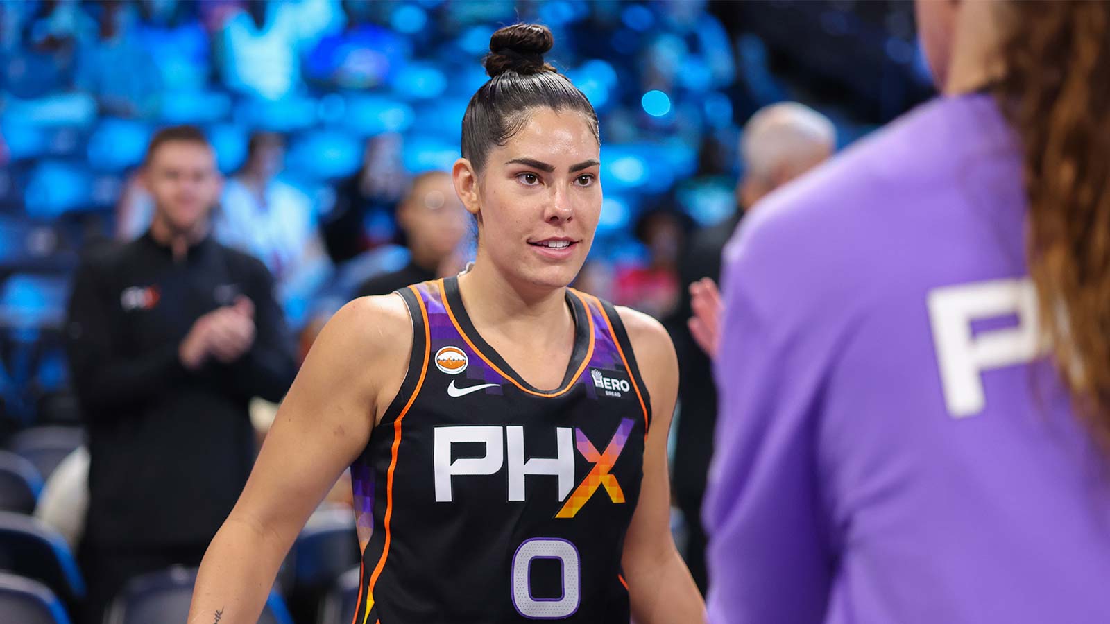 Mercury’s Kelsey Plum catches Dream’s Karl Smesko in a fast-break bear hug