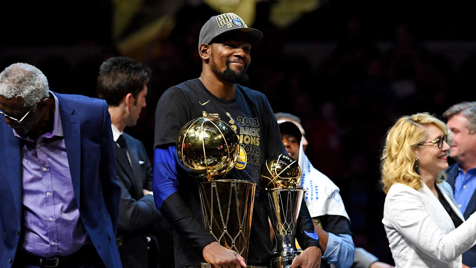 Golden State Warriors forward Kevin Durant (35) celebrates with the Bill Russell NBA Finals Most Valuable Player Award and the Larry O'Brien Championship Trophy after beating the Cleveland Cavaliers in game four of the 2018 NBA Finals at Quicken Loans Arena. 