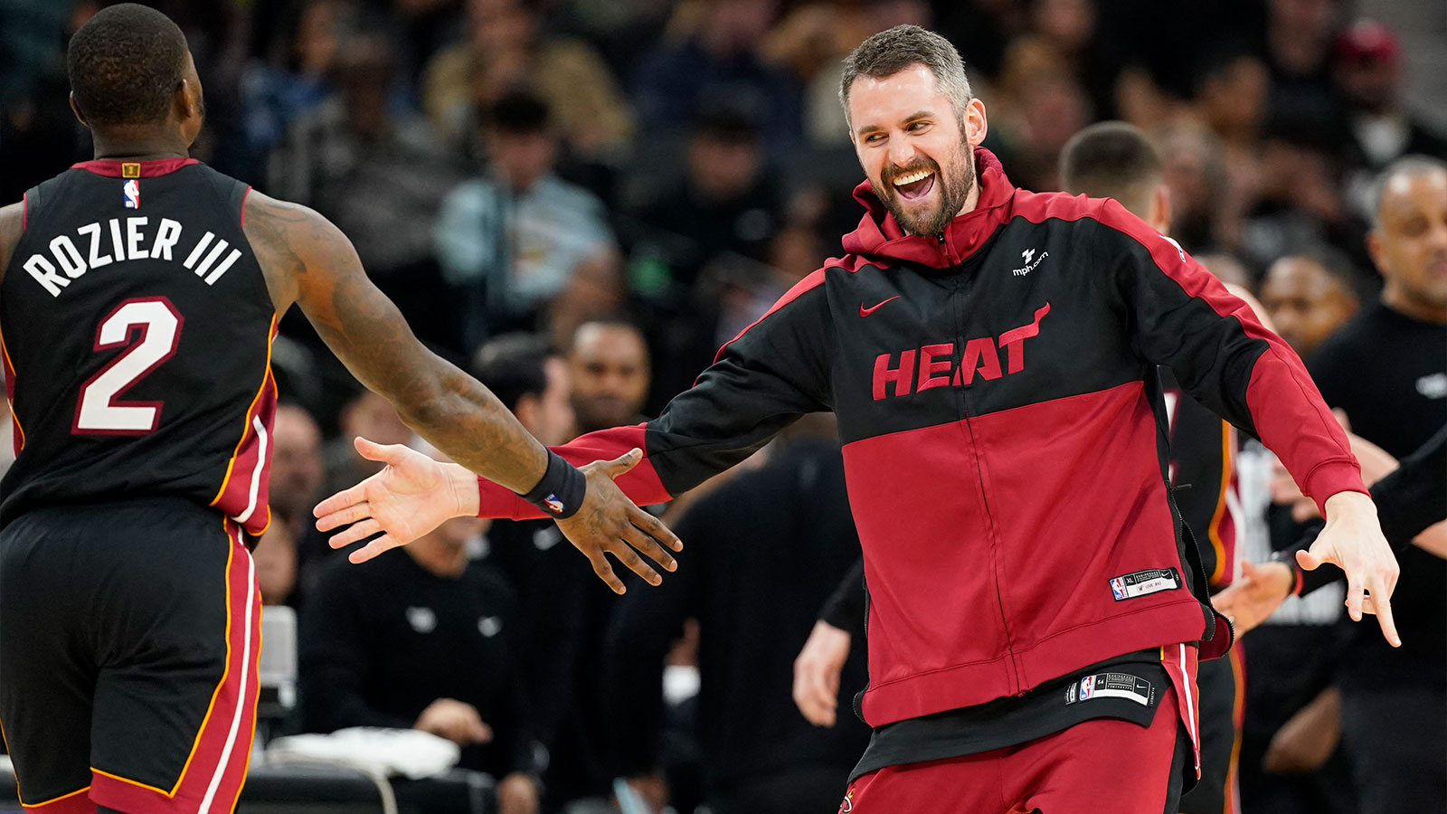 Miami Heat forward Kevin Love (42) reacts after guard Terry Rozier (2) scored during the second half against the San Antonio Spurs at Frost Bank Center. 