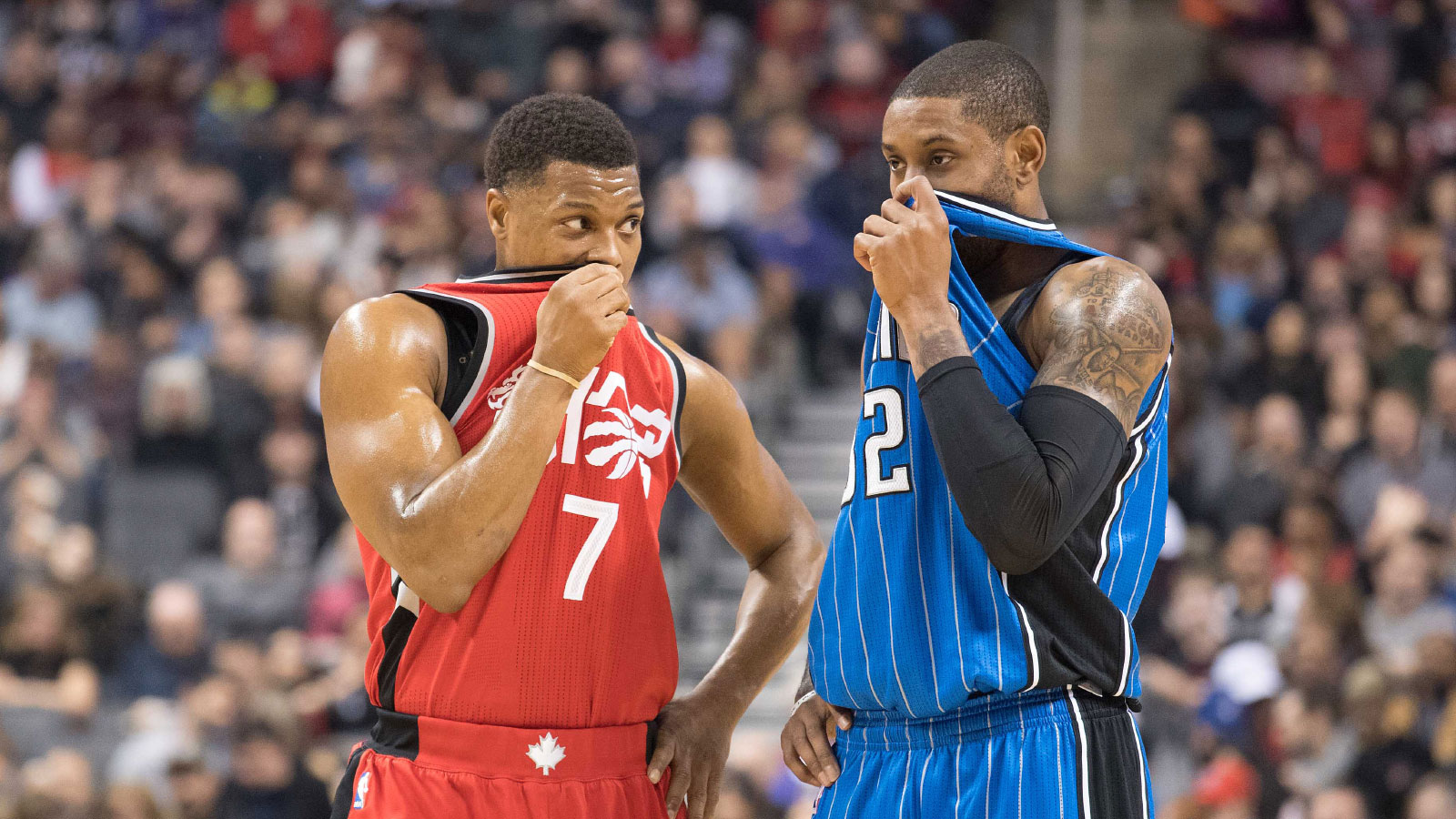 Toronto Raptors guard Kyle Lowry (7) talks to Orlando Magic guard C.J. Watson (32) during the second quarter in a game at Air Canada Centre.
