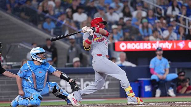 Aug 2, 2026; Toronto, Ontario, CAN; St. Louis Cardinals right ielder Lars Nootbaar (21) gets on base on an error with a run scored against the Toronto Blue Jays during the ninth inning at Rogers Centre. Mandatory Credit: Nick Turchiaro-Imagn Images