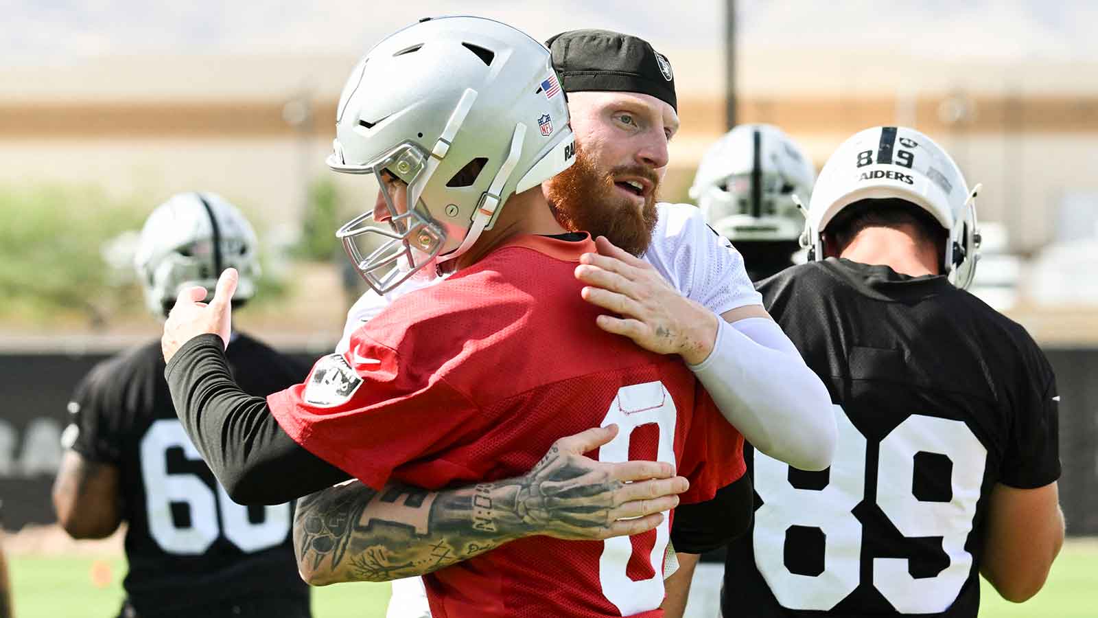 https://wp.clutchpoints.com/wp-content/uploads/2026/08/Maxx-Crosby-Kirk-Cousins-hugging-during-Raiders-OTAs.jpg