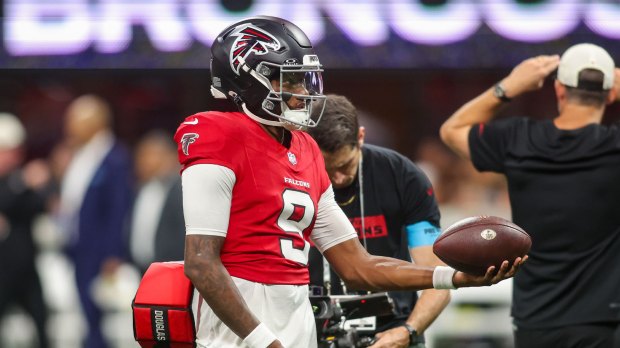 Atlanta Falcons quarterback Michael Penix Jr. (9) warms up before a game against the Denver Broncos at Mercedes-Benz Stadium.