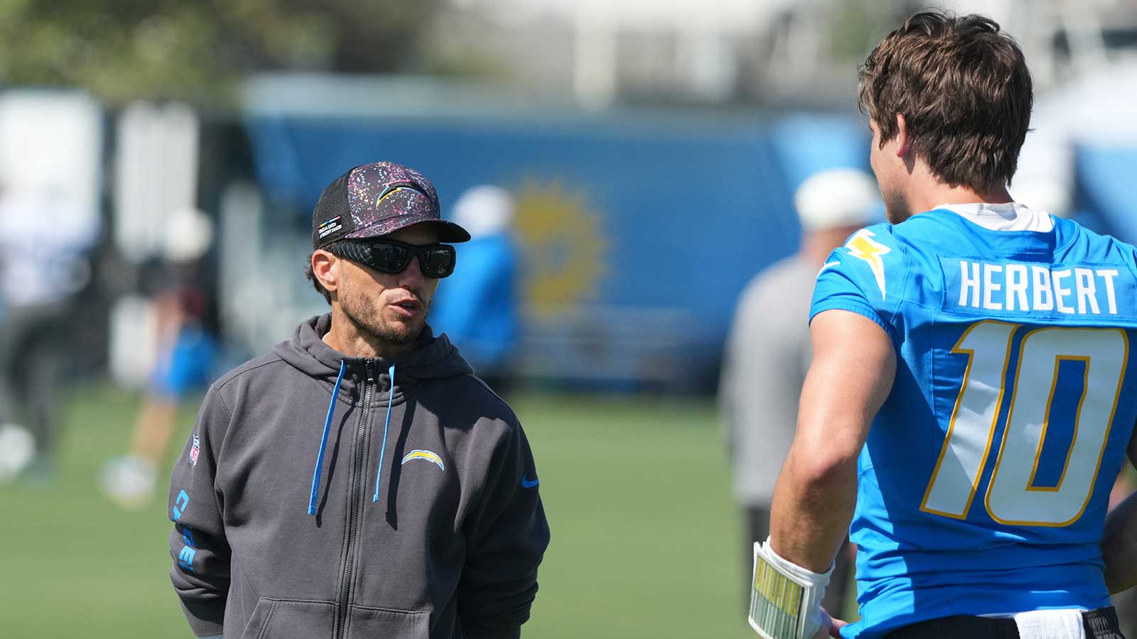 https://wp.clutchpoints.com/wp-content/uploads/2026/08/Mike-McDaniel-and-Justin-Herbert-at-training-camp.jpg