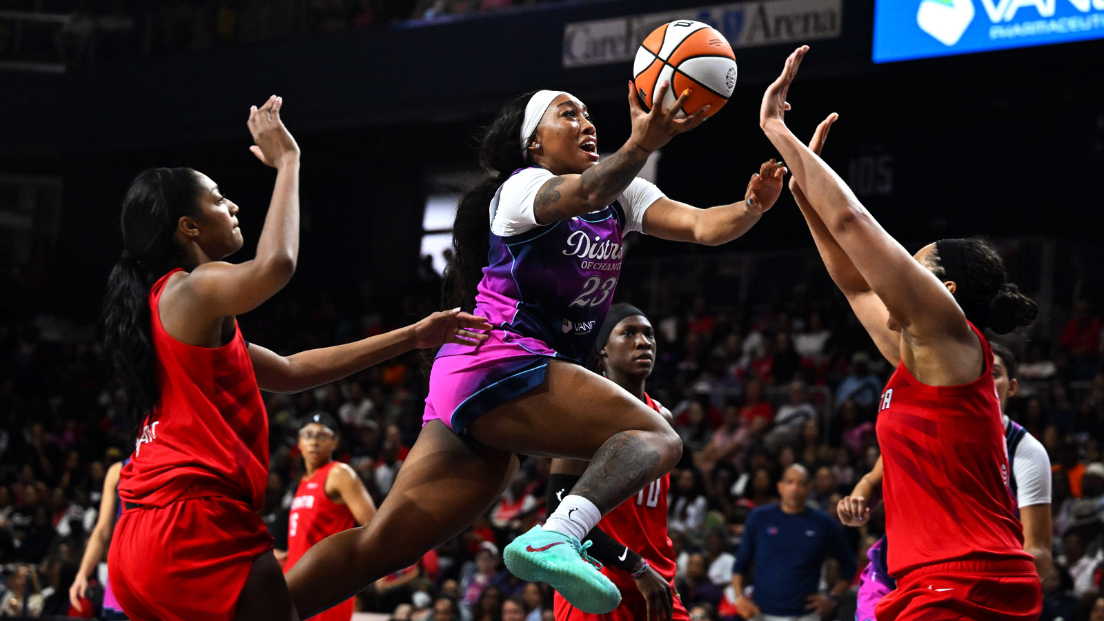 Washington Mystics guard Cotie McMahon (23) shoots over Atlanta Dream forward Brionna Jones (42) and forward Angel Reese (5) during the second half at CareFirst Arena.