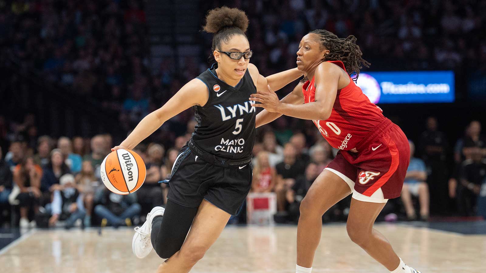 Fever’s Kelsey Mitchell gets her flowers from Olivia Miles after titanic Indiana-Lynx clash