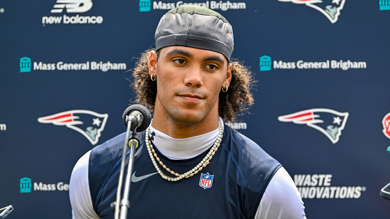 https://wp.clutchpoints.com/wp-content/uploads/2026/08/Patriots-star-CB-Christian-Gonzalez-speaks-to-reporters-a-training-camp.jpg