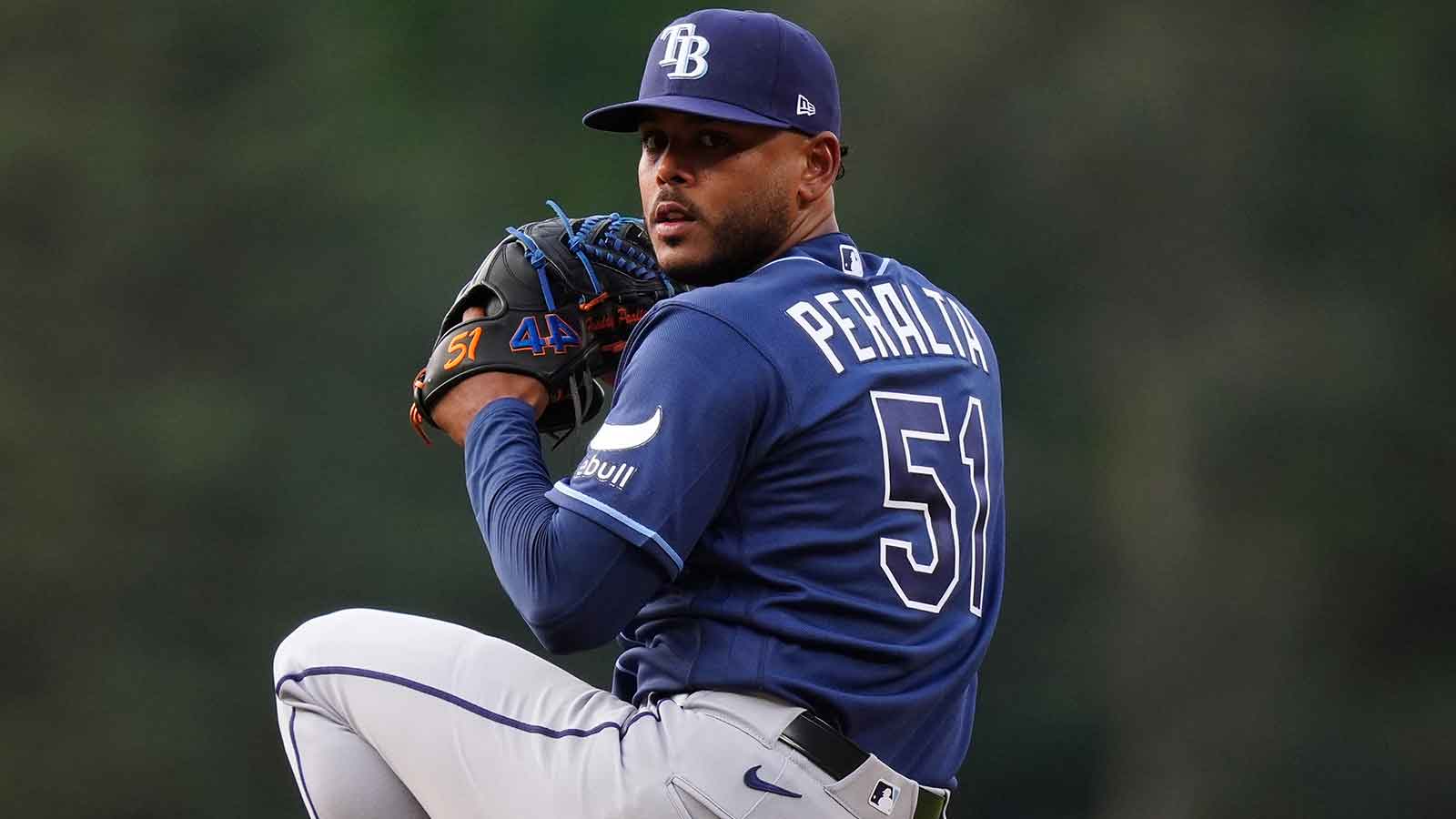 Rays starting pitcher Freddy Peralta (51) delivers a pitch