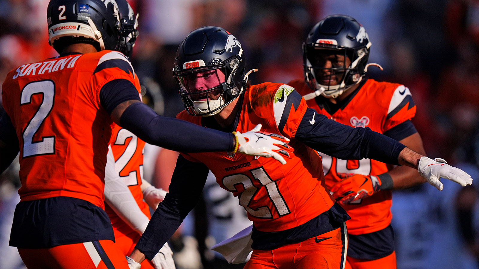 Denver Broncos cornerback Riley Moss (21) reacts against the Jacksonville Jaguars during the first half at Empower Field at Mile High. 