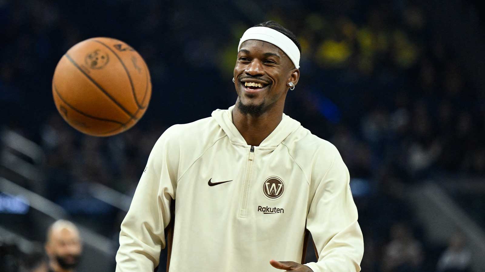 Watch Warriors’ Jimmy Butler fall out of his seat after shocking magic trick