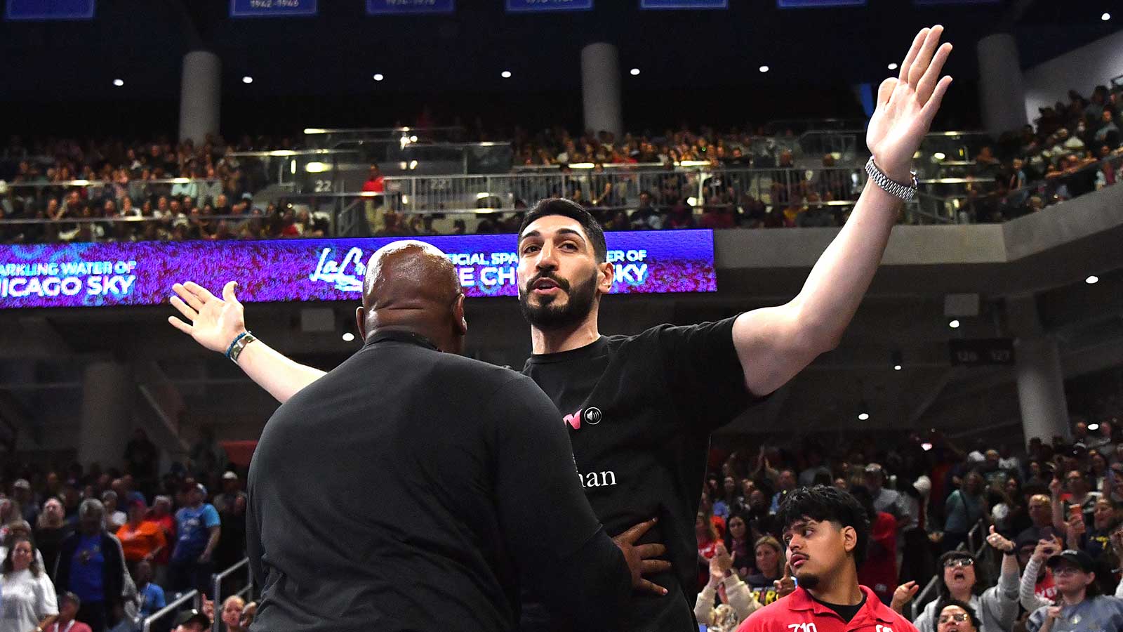Turkish-American former basketball player and human rights activist Enes Kanter Freedom reacts as he is removed from the arena during the second half against the Indiana Fever at Wintrust Arena. Mandatory Credit: Patrick Gorski-Imagn Images