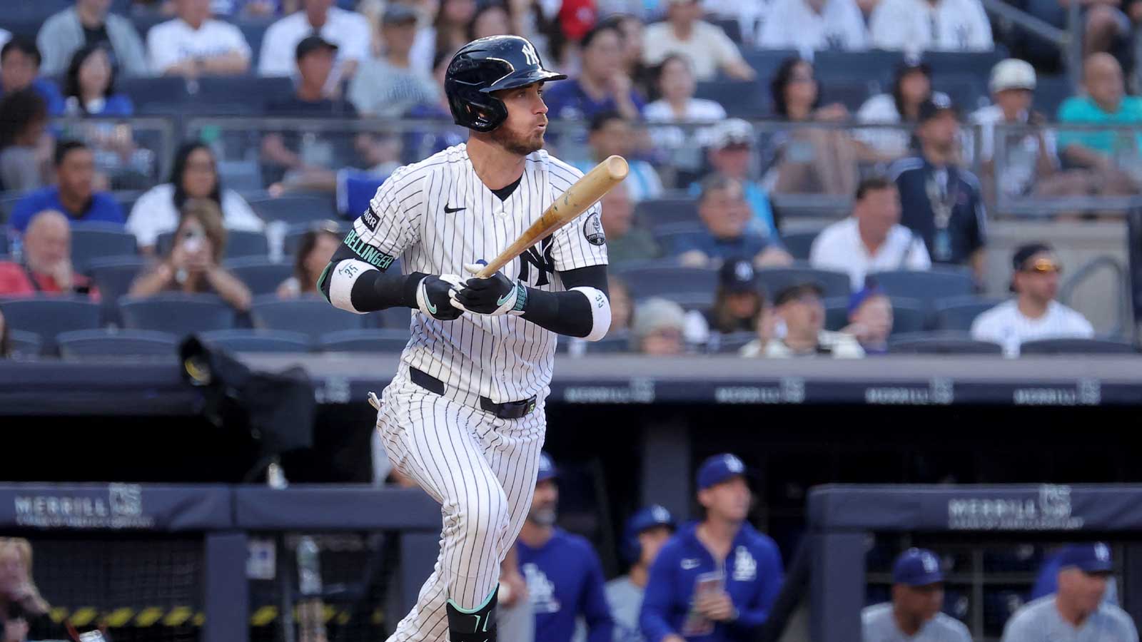 New York Yankees left fielder Cody Bellinger (35) follows through on an RBI single against the Los Angeles Dodgers during the first inning at Yankee Stadium. Mandatory Credit: Brad Penner-Imagn Images