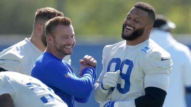 Los Angeles Rams defensive end Aaron Donald (99) and coach Sean McVay react during minicamp at Cal Lutheran University