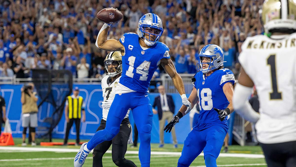 Detroit Lions wide receiver Amon-Ra St. Brown (14) reacts after catching a touchdown pass against the New Orleans Saints in overtime at Ford Field.