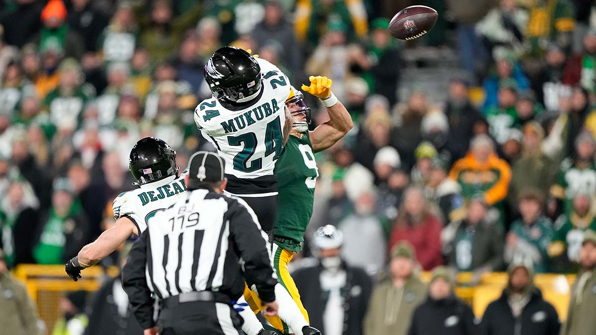 Philadelphia Eagles safety Andrew Mukuba (24) breaks up the pass to Green Bay Packers wide receiver Christian Watson (9) in the second half at Lambeau Field.