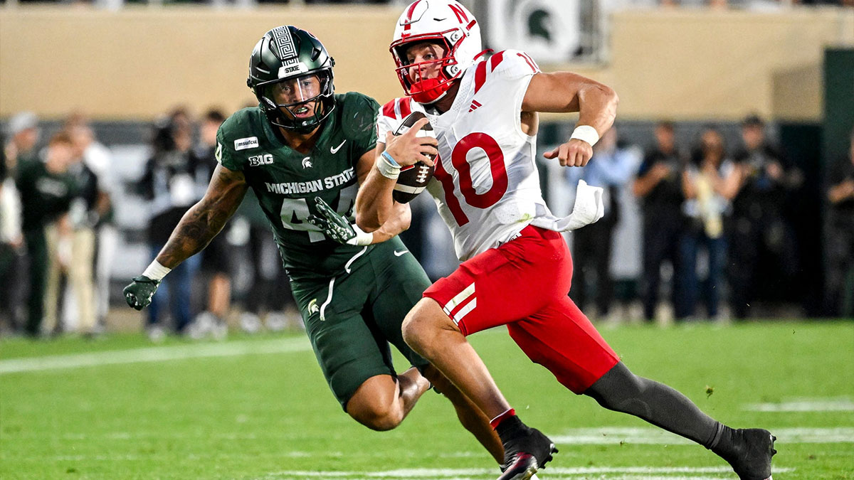 Michigan State’s Caleb Wheatland, left, closes in on Nebraska’s Anthony Colandrea on a run during the third quarter on Saturday, Sept. 26, 2026, in East Lansing.