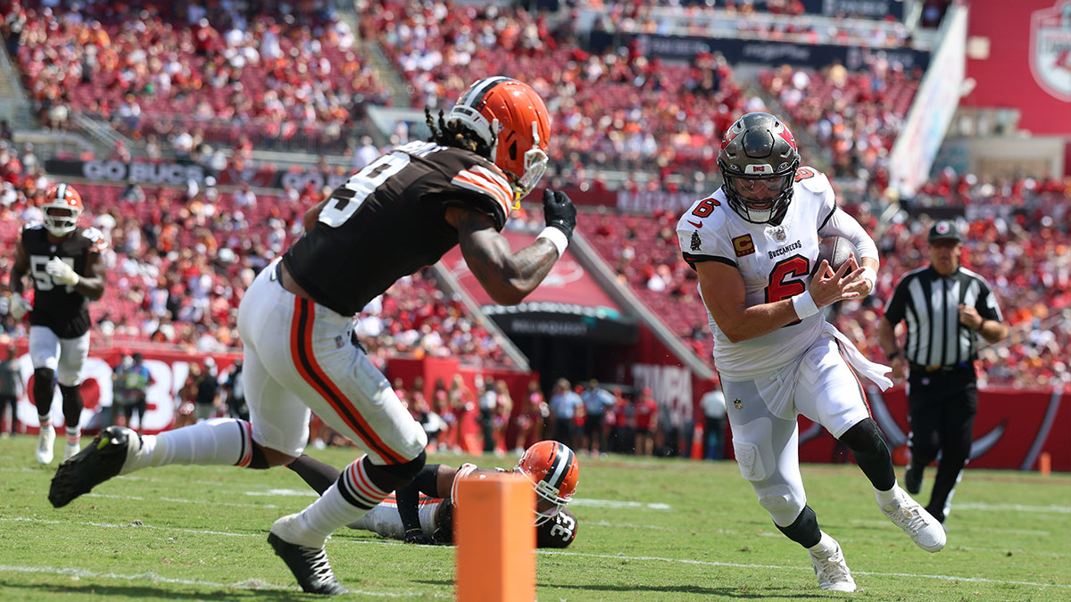 Tampa Bay Buccaneers quarterback Baker Mayfield (6) runs the ball against Cleveland Browns safety Grant Delpit (9) during the second half at Raymond James Stadium.