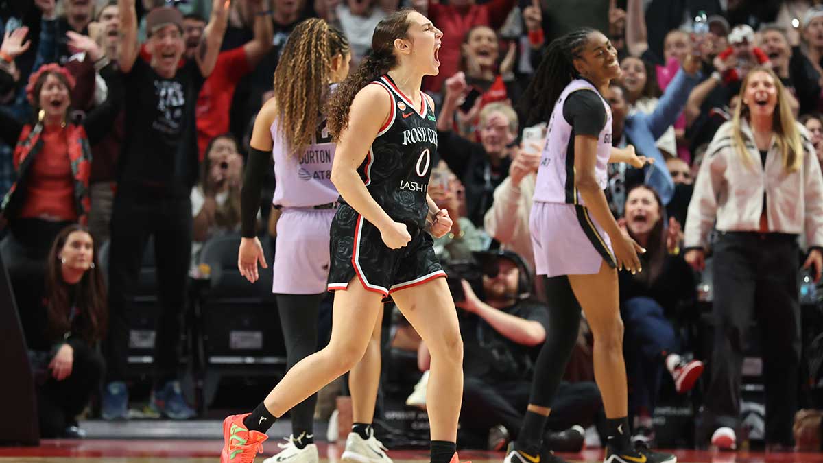 Sep 22, 2026; Portland, Oregon, USA; Portland Fire guard Carla Leite (0) reacts after scoring against the Golden State Valkyries to give the Fire a 77-75 lead at Moda Center. Mandatory Credit: Jaime Valdez-Imagn Images
