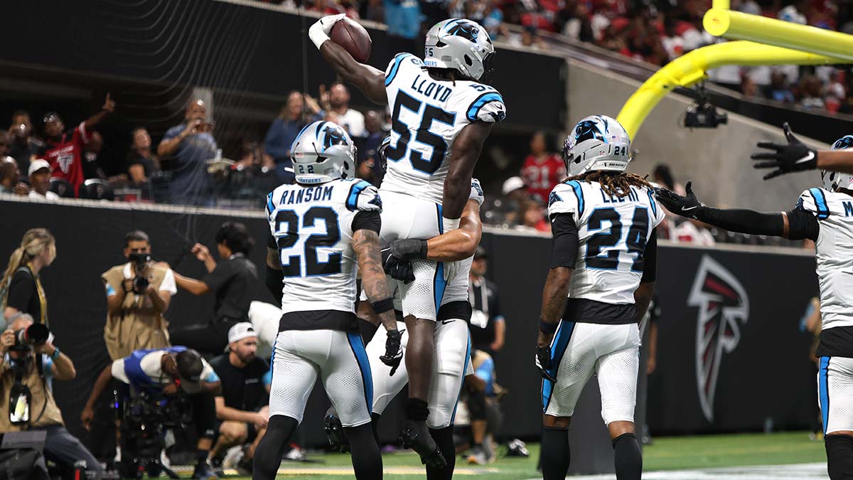 Sep 20, 2026; Atlanta, Georgia, USA; Carolina Panthers linebacker Devin Lloyd (55) celebrates with teammates after scoring a touchdown on an interception during the third quarter against the Atlanta Falcons at Mercedes-Benz Stadium.