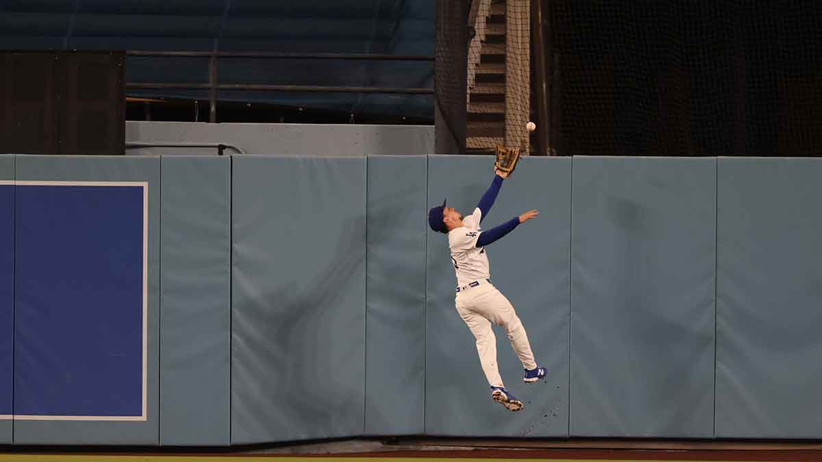 Watch Dodgers’ Kyle Tucker leap over the wall for bonkers robbery vs. Nationals