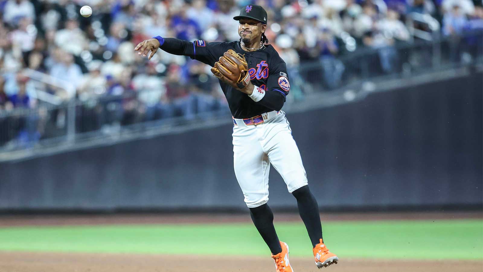 New York Mets shortstop Francisco Lindor (12) makes a running throw to first base for an assist in the sixth inning against the Philadelphia Phillies at Citi Field.