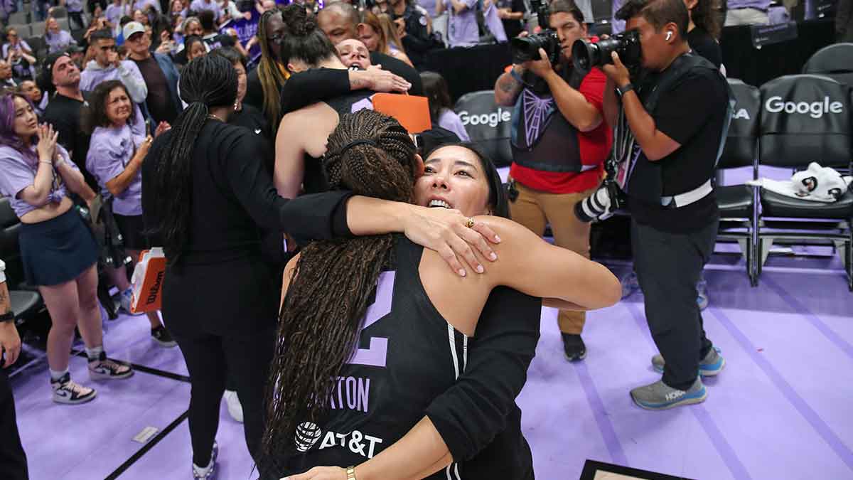 Sep 17, 2025; San Jose, California, USA; Golden State Valkyries head coach Natalie Nakase hugs guard Veronica Burton (22) after the loss against the Minnesota Lynx in game two of round one for the 2025 WNBA Playoffs at SAP Center. Mandatory Credit: David Gonzales-Imagn Images