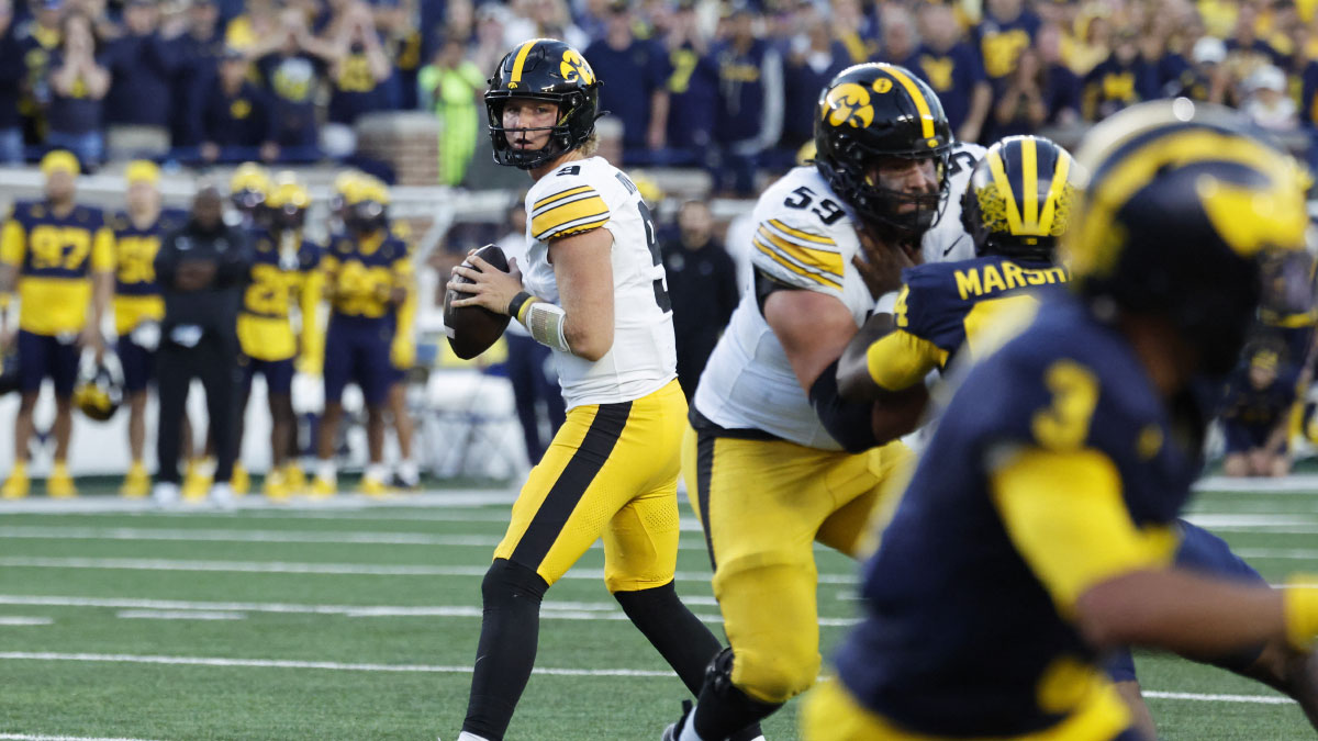 Iowa Hawkeyes quarterback Hank Brown (9) looks to pass against the Michigan Wolverines during the second half at Michigan Stadium.