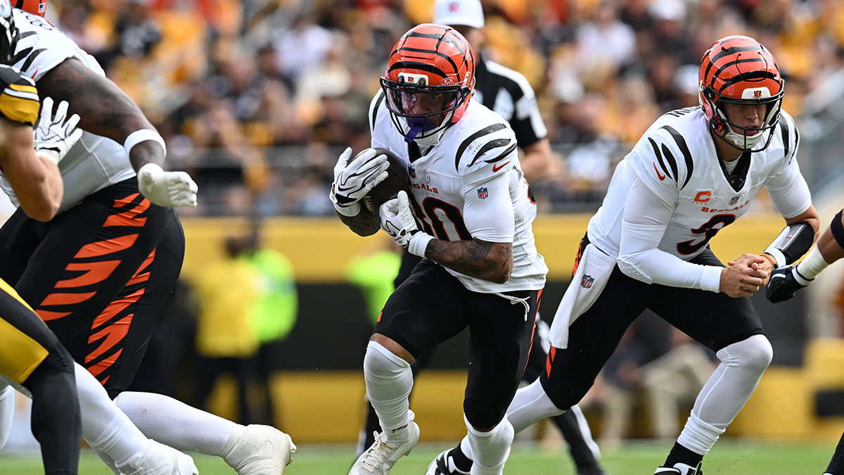 Cincinnati Bengals halfback Chase Brown (30) runs during the second quarter against the Pittsburgh Steelers at Acrisure Stadium.