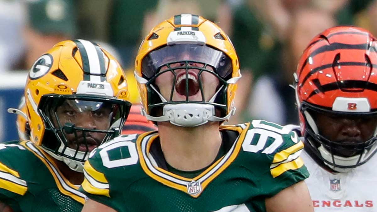 Green Bay Packers defensive end Lukas Van Ness (90) celebrates after sacking Cincinnati Bengals quarterback Joe Flacco (16) during the game at Lambeau Field.