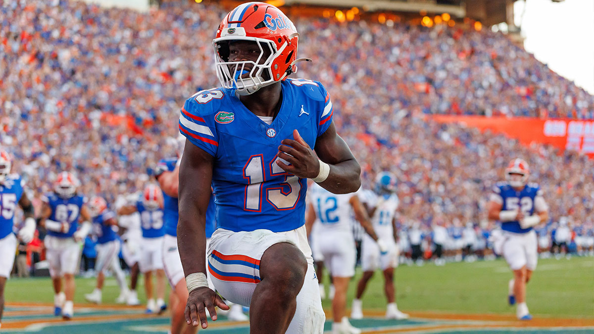 Florida Gators running back Jadan Baugh (13) celebrates with a Heisman pose against the Mississippi Rebels during the second half at Ben Hill Griffin Stadium.