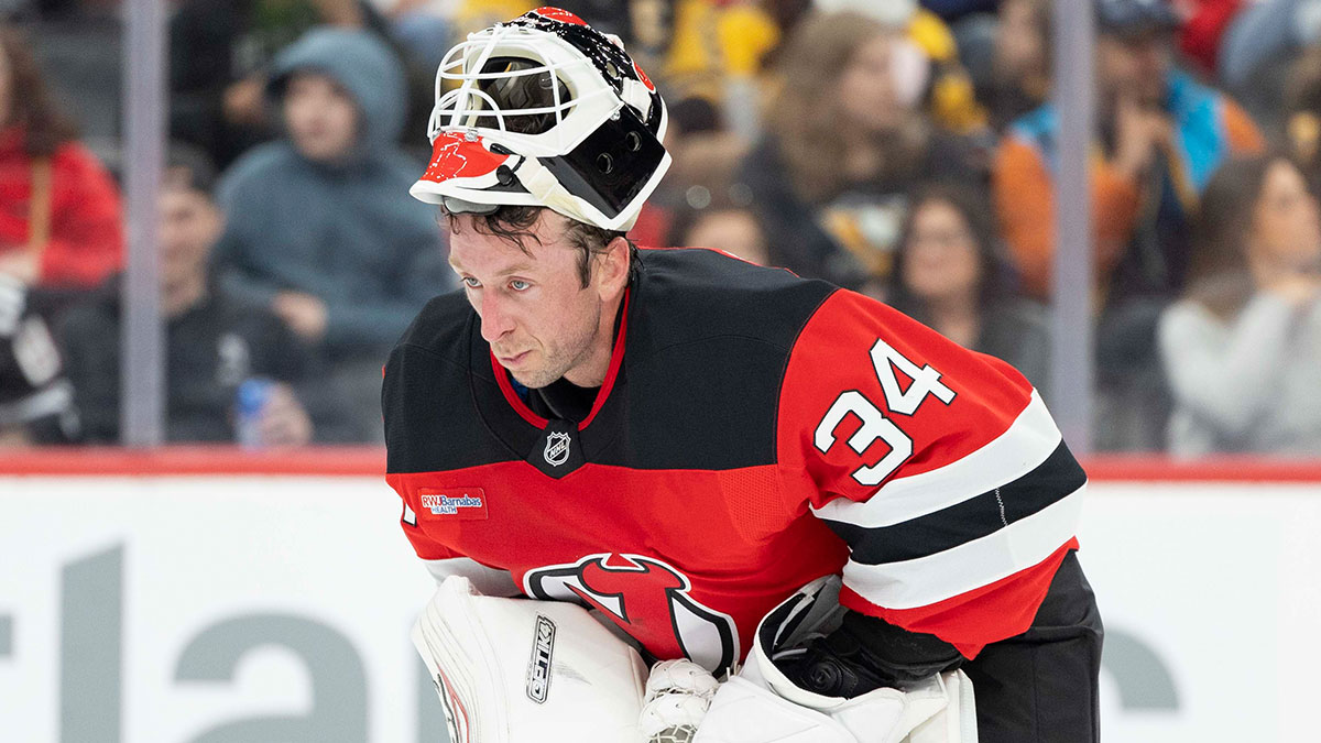 New Jersey Devils goaltender Jake Allen (34) takes a break during a stoppage in play during the first period against the Pittsburgh Penguins at Prudential Center.