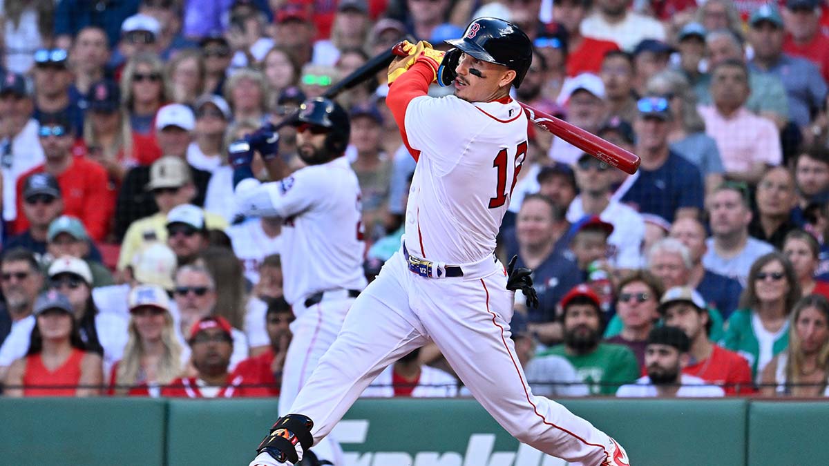Boston Red Sox left fielder Jarren Duran (16) hits a double against the Los Angeles Angels during the fifth inning at Fenway Park.