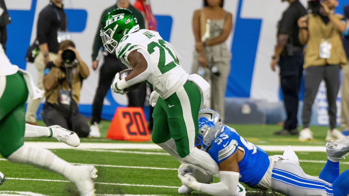 https://wp.clutchpoints.com/wp-content/uploads/2026/09/Jets-RB-Breece-Hall-being-tackled-by-Lions-defender.jpg