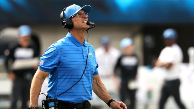 Los Angeles Chargers head coach Jim Harbaugh reacts after a play against the Arizona Cardinals during the first half at SoFi Stadium.