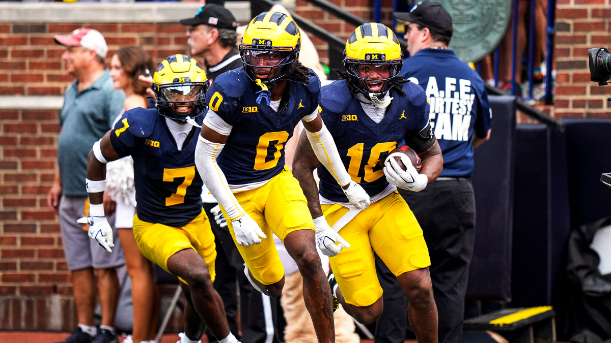 Michigan cornerback Jyaire Hill (0), center, celebrates an interception against Oklahoma with cornerback Zeke Berry (10), and safety Chris Bracy (7) during the second half at Michigan Stadium in Ann Arbor on Saturday, Sept. 12, 2026.