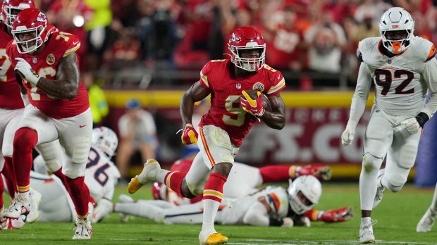 Kansas City Chiefs running back Kenneth Walker III (9) rushes the ball against the Denver Broncos in the first half at GEHA Field at Arrowhead Stadium.