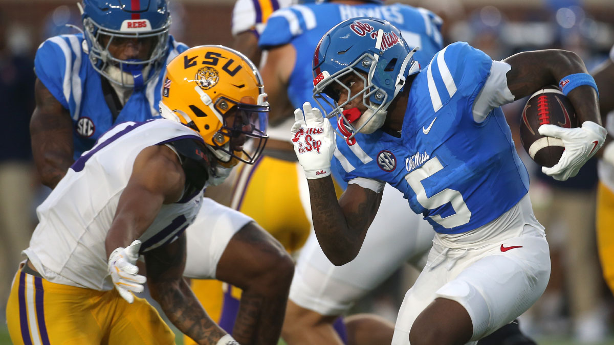 Mississippi Rebels running back Kewan Lacy (5) carries the ball against the Louisiana State Tigers during the first half at Vaught-Hemingway Stadium. 