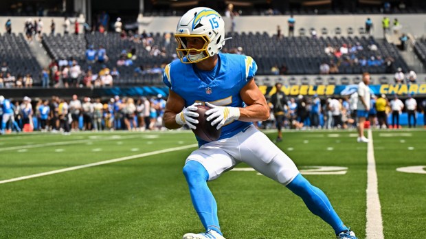 Los Angeles Chargers wide receiver Ladd McConkey (15) warms up prior to a game against the Arizona Cardinals at SoFi Stadium.