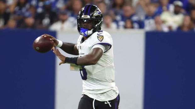 Baltimore Ravens quarterback Lamar Jackson (8) throws the ball against the Indianapolis Colts at Lucas Oil Stadium.